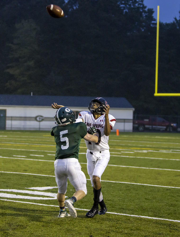 Cave Spring's (10) Ethan Coates catches a deep pass and breaks free for a touchdown. Glenvar's (5) Bradey Loder tries to break the pass up.
